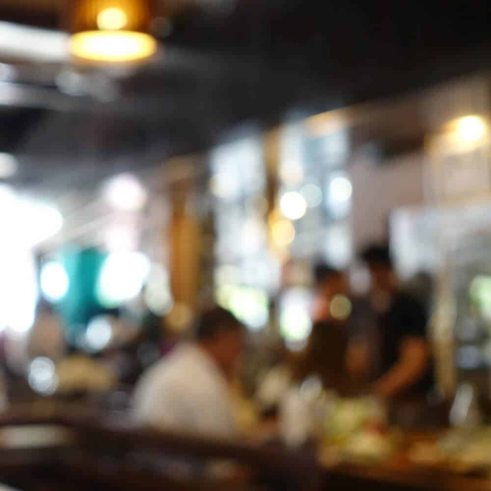 blurred image of people at resturant