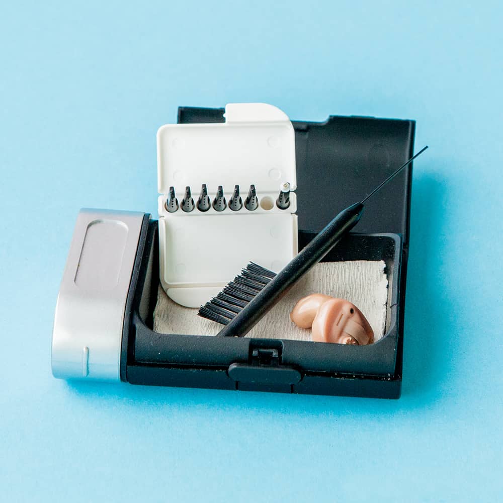 hearing aid box with cleaning accessories