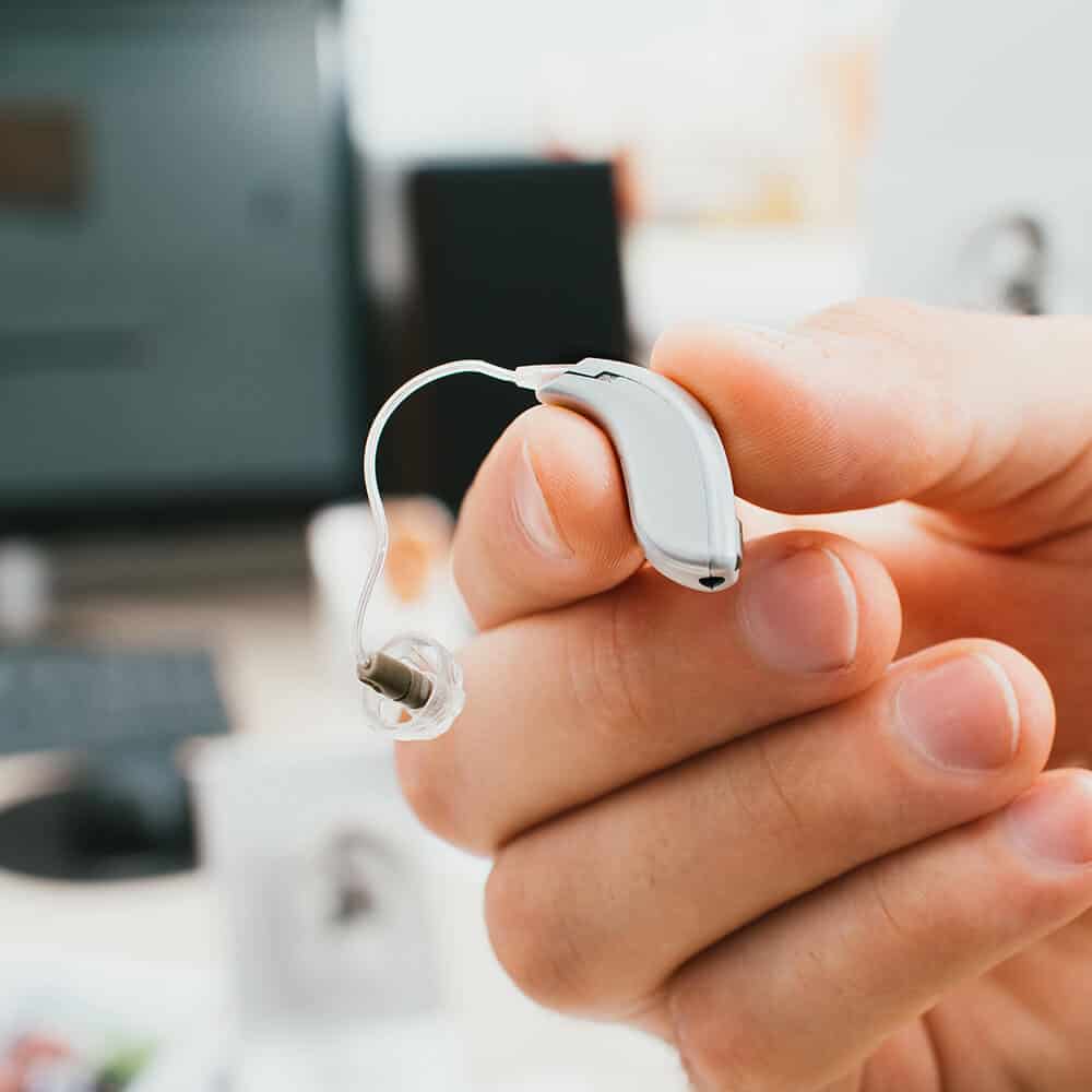 hearing aid being held