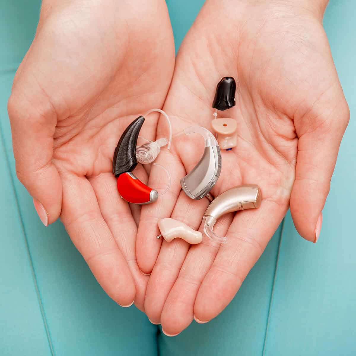hearing aids in audiologist hands