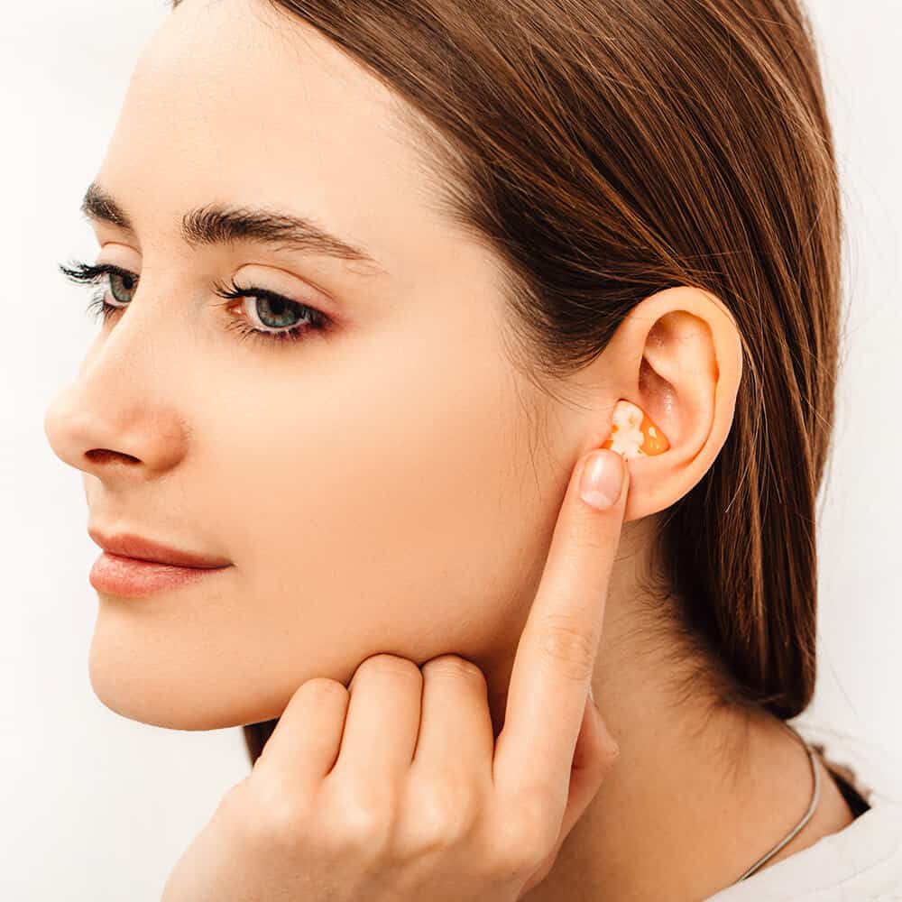 woman wearing ear plug